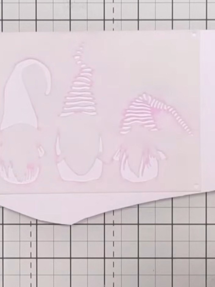 Step 1: Gather your three gnome stencils and arrange them in numerical order on your craft mat, ensuring the numbers a