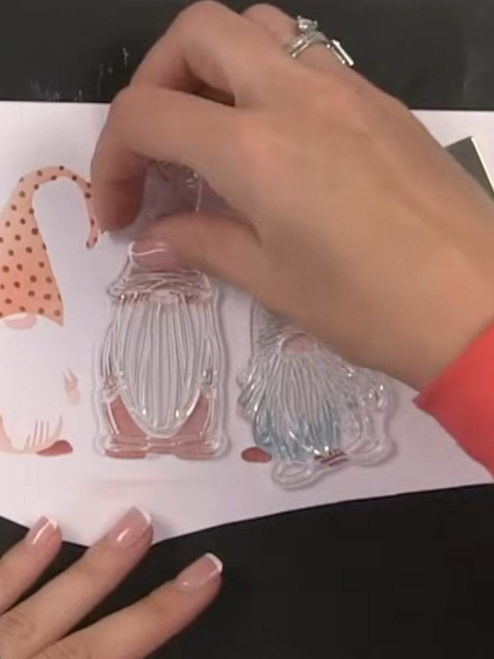 Step 10: Die-cut all three gnomes together in one pass using the outline die. The gnomes are joined together for conven