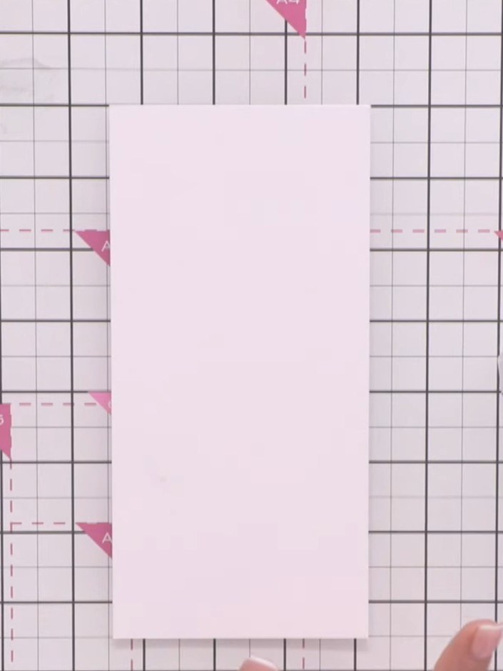 Step 3: Spray the white cardstock twice with water using a spray bottle to create a wet surface for the watercolour ef