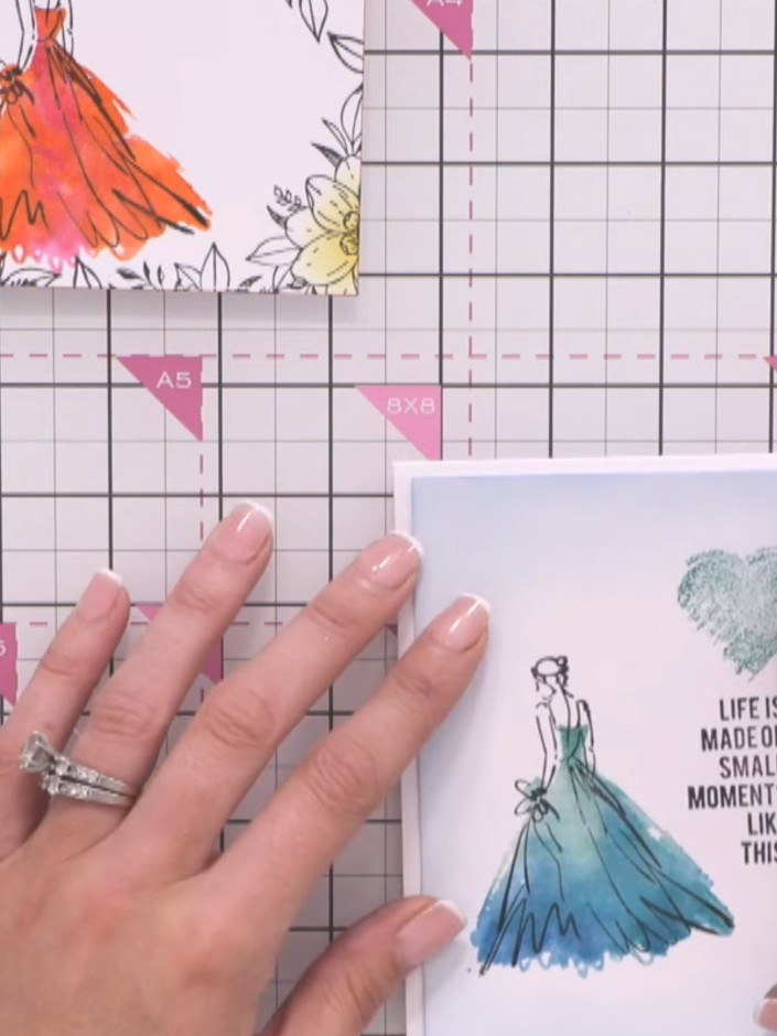 Step 12: Mount the finished stamped and coloured design onto a white card blank. Position the card centrally and smooth