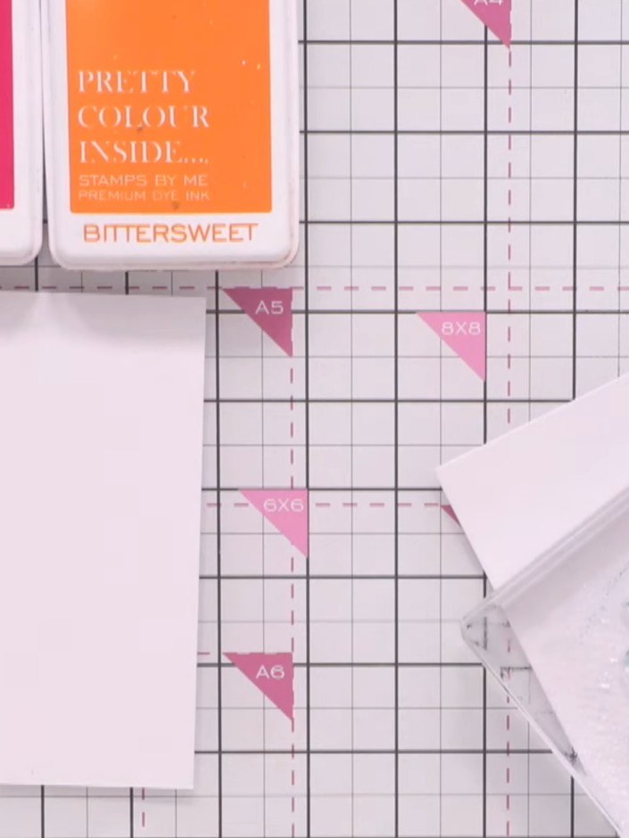 Step 5: Repeat the process with pink and orange inks on a second piece of white cardstock. Allow the colours to blend 