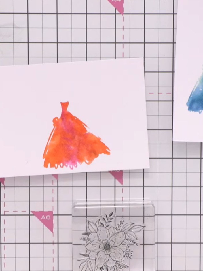 Step 8: Stamp floral elements around the gown using the floral stamp from the set. Create a frame or bouquet effect ar