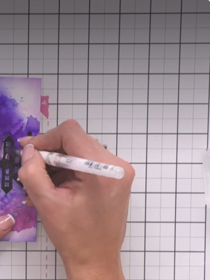 Step 7: Using a white gel pen, add highlights down the left side of the building windows to create dimension and sugge