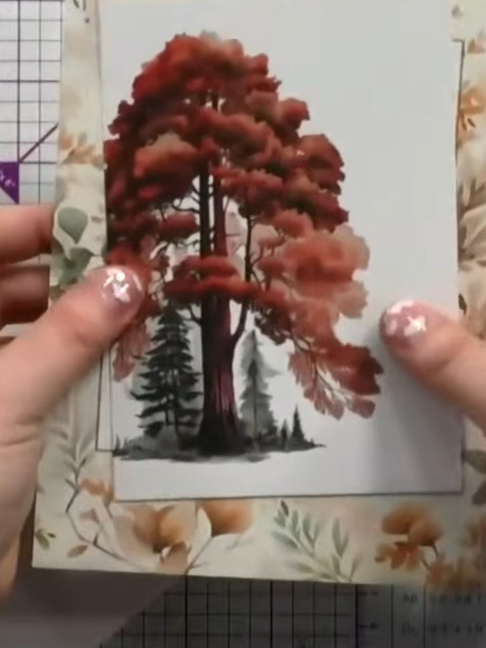 Step 2: Carefully snip away the leaf design from the rubon transfer sheet using scissors. Keep the bag away from the d