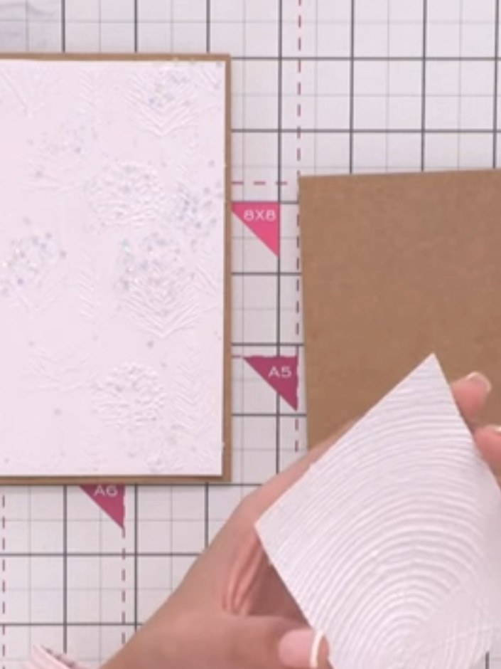 Step 12: Mount the completed stag onto the embossed background card base using small foam pads made from scrap cardstoc