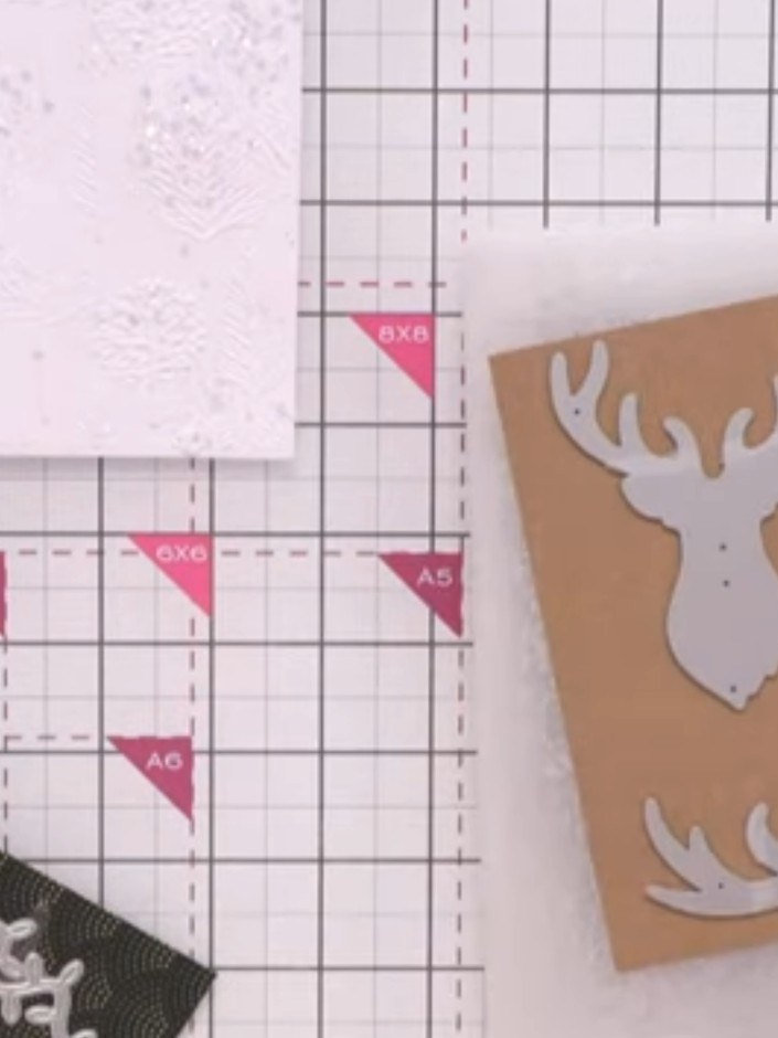 Step 5: Die-cut the stag head from the Joyeux Noel die set using both white and craft cardstock to create layered piec