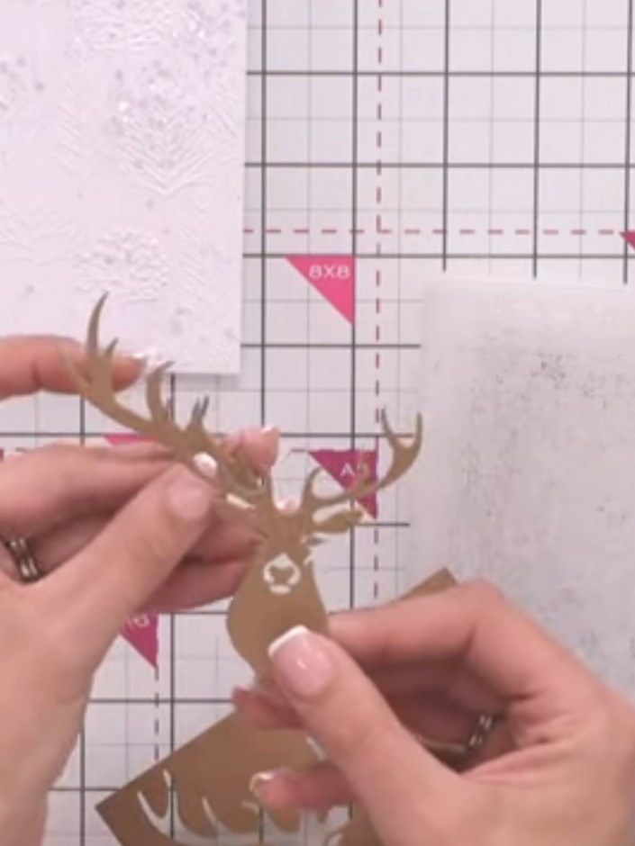 Step 6: Die-cut the extended antlers from white cardstock. Cut multiple sets of the antlers to build up dimension for 