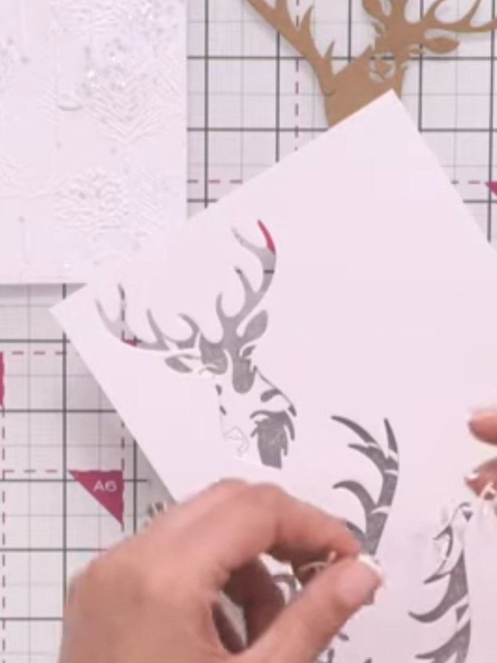 Step 7: Die-cut the light formation pieces from white cardstock. These decorative elements will be positioned to inter