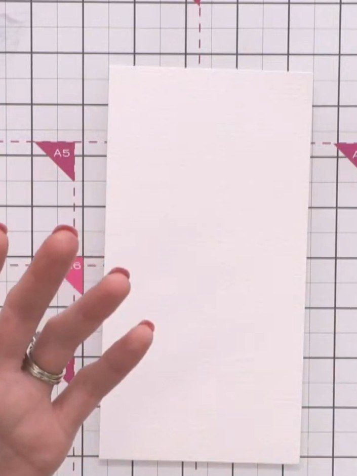 Step 1: Take a piece of watercolour card and place it on your craft mat. Spritz the top surface of the card with water