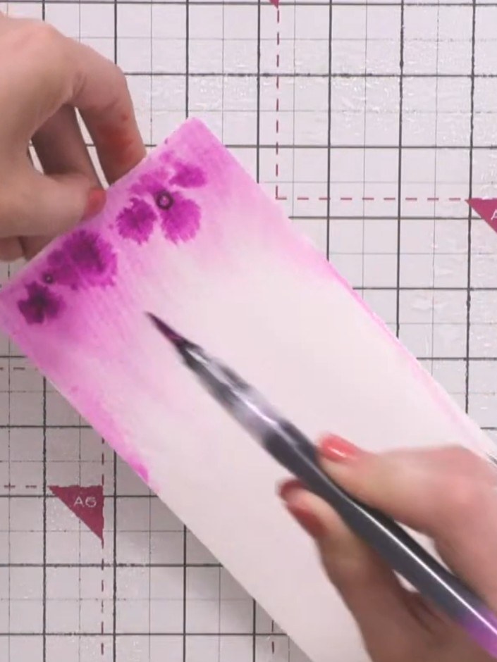Step 4: Apply orange and pink water brush pen colours to different areas of the card panel. Leave some white space bet