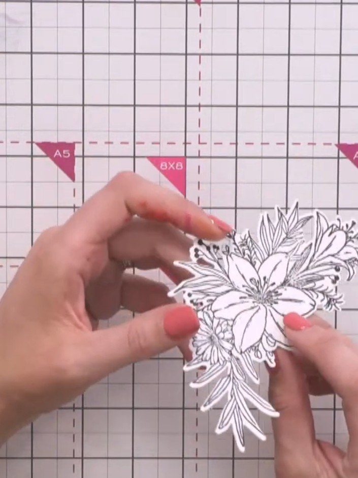 Step 7: Estampa el diseño floral en cartulina blanca con tinta negra. Position the stamp carefully and press firmly to
