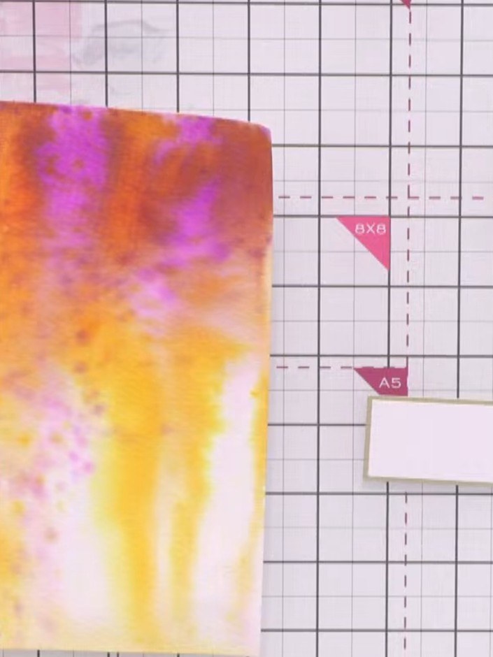 Step 1: Prepare a watercolour background on white card using orange, pink and yellow inks, blending from darker tones 
