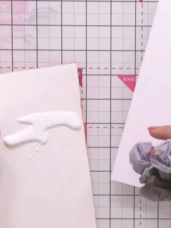 Step 4: Gently pinch and nudge the foliage and texture elements of the die-cut floral arrangement to add subtle dimens
