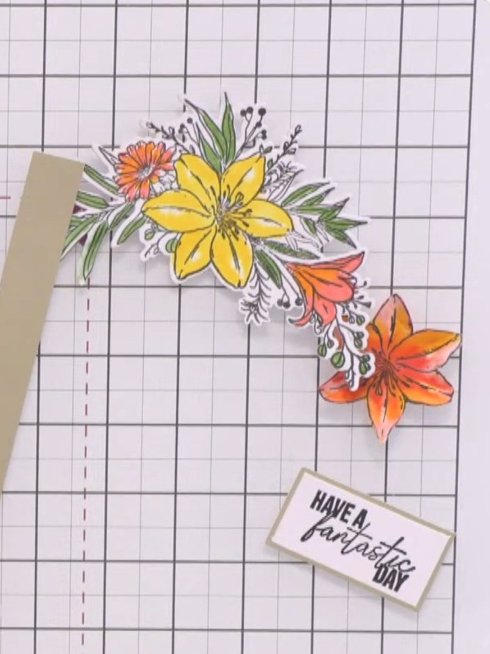 Step 5: Adhere the die-cut coloured flower arrangement to the top of the white card panel using adhesive. Position it 