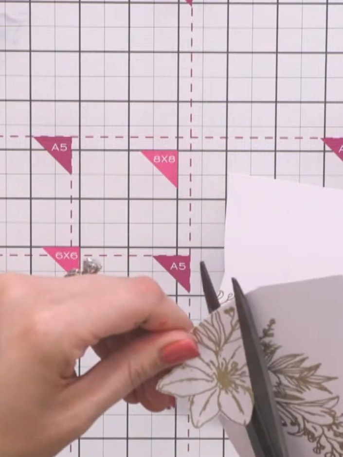 Step 12: Mount all the stamped and embossed elements onto your folded card base. Position the acetate overlay on top to