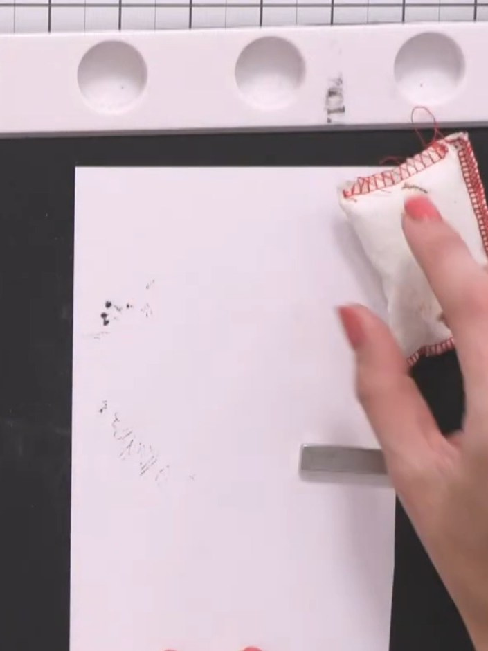 Step 4: Tap the card gently to remove any excess embossing powder. Return the loose powder back into its container for