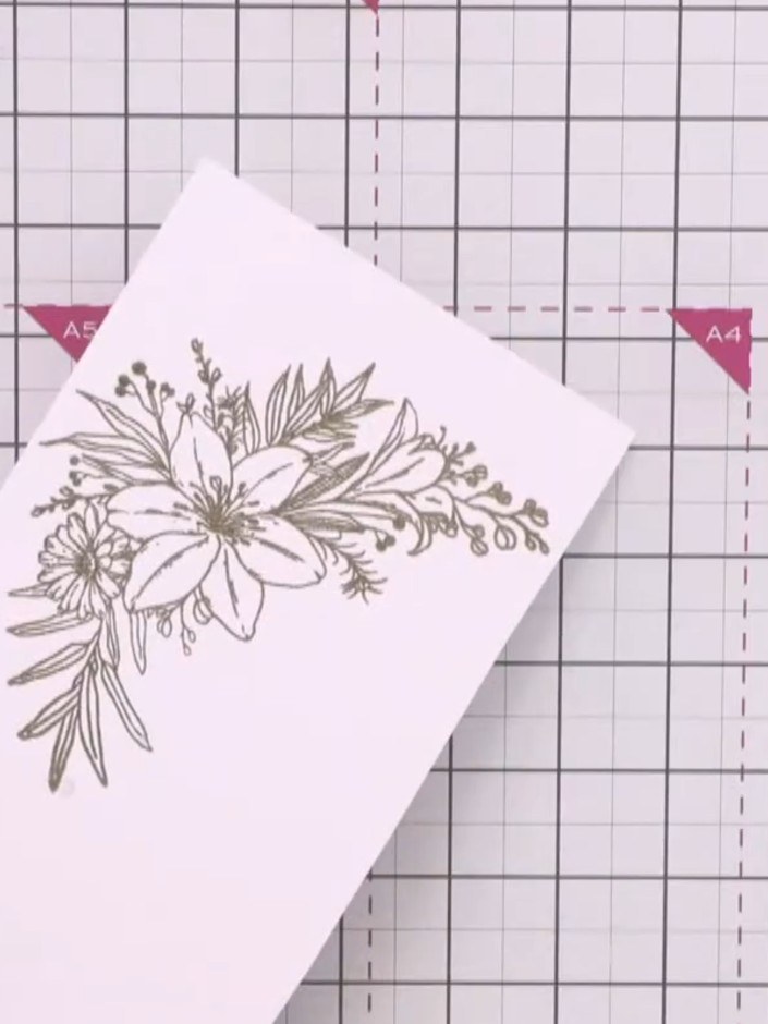 Step 8: Adhere the acetate panel to the patterned paper background using red liner tape or a tape pen. Position the ac