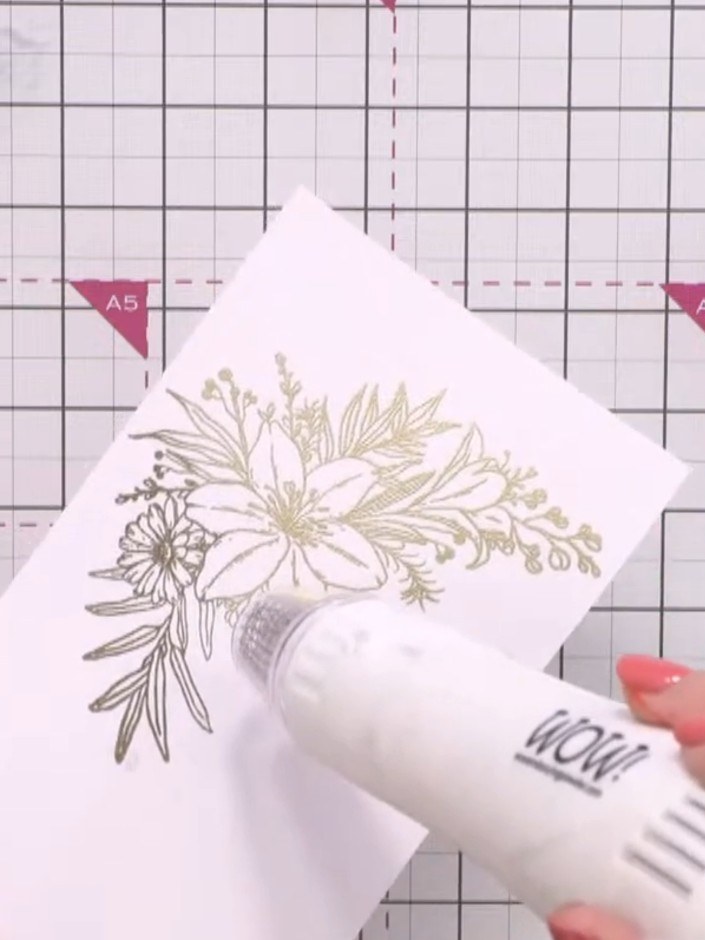 Step 9: Stamp a sentiment onto white cardstock using black ink. The stamped image shows a floral bouquet design in gol