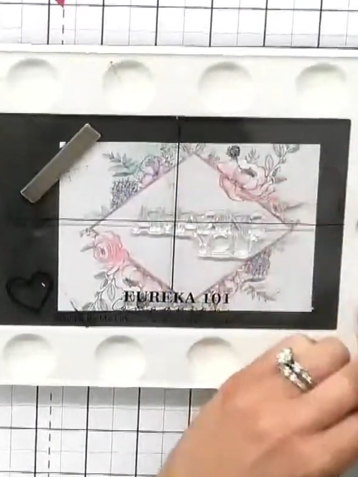 Step 4: Select your chosen sentiment from the stamp set. The example shows 'EUREKA 101' being positioned on the black 
