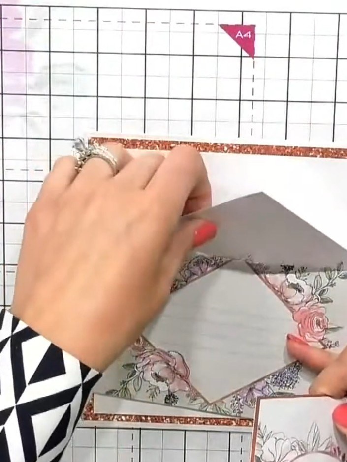 Step 8: Add fussy-cut floral elements from the Garden Florals design to the corners of your card using foam pads for d