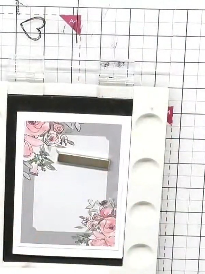 Step 5: Position one of the fussy-cut floral elements so it extends from the corner arrangement to the edge of the car