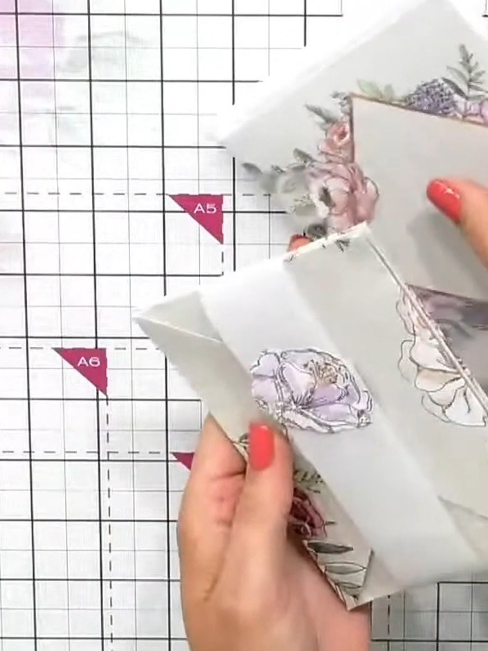 Step 9: Add a coordinating sticker to the front of the belly band to seal and embellish your gift set. Position the st