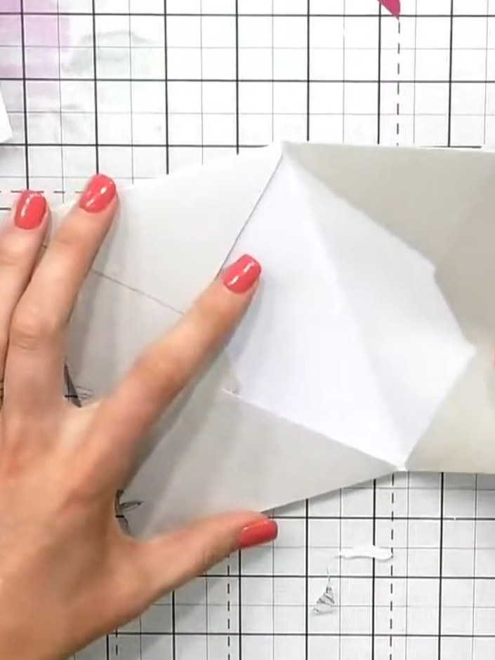 Step 5: Apply glue to the back of the second envelope and position it inside the first envelope to create the album bi