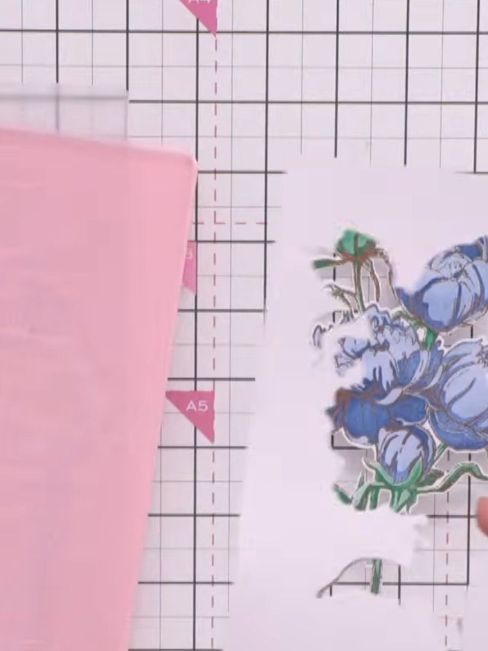 Step 8: Place the die-cut peony piece into the embossing folder, aligning it with the front edge. Run through your die