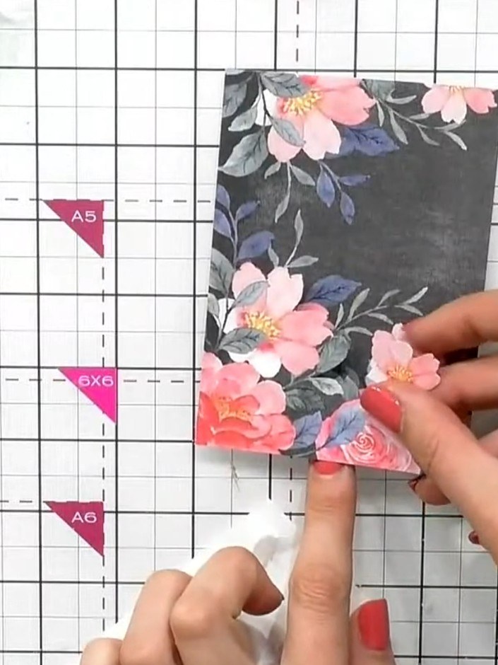 Step 5: Adhere the padded floral elements to the first topper using adhesive. Layer them to create dimension, position