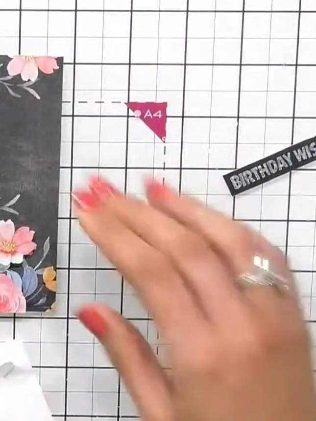 Step 7: Position the 'BIRTHDAY WISHES' sentiment banner in the top right corner of the card front and attach it using 