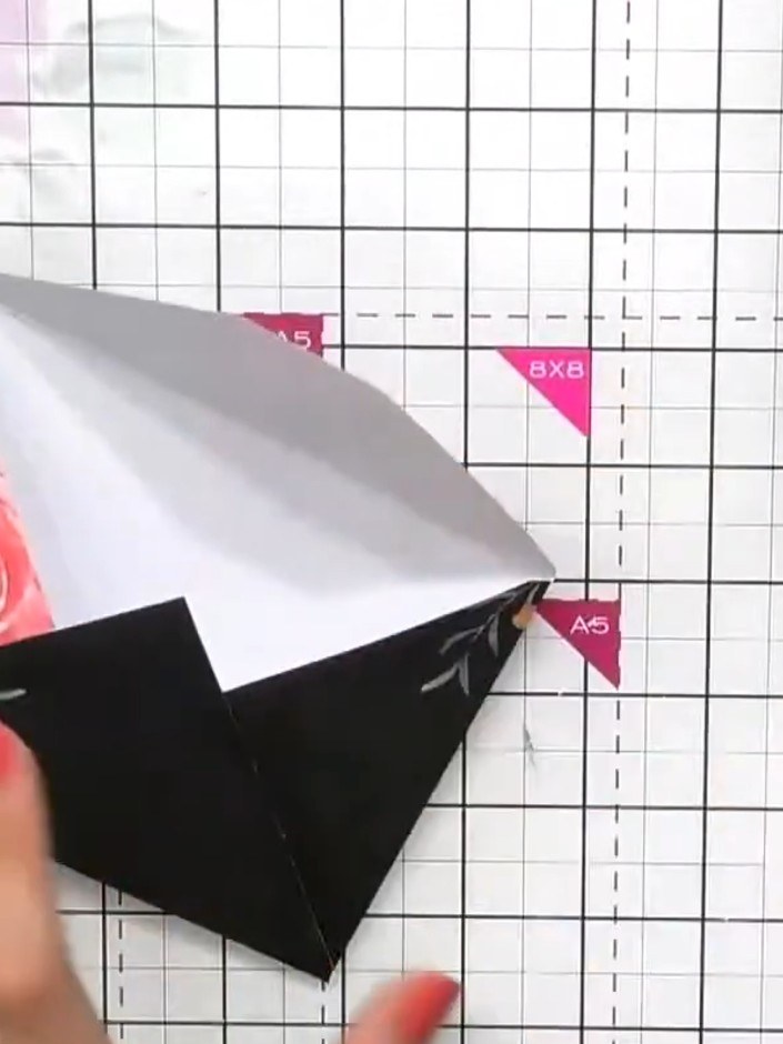 Step 2: Fold along all the pre-scored lines on the envelope to create the envelope shape. Crease each fold firmly to d