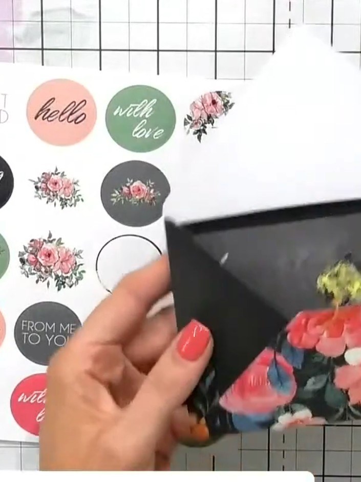 Step 6: Select a coordinating sticker from the charcoal roses sticker set. Choose a design that complements your envel