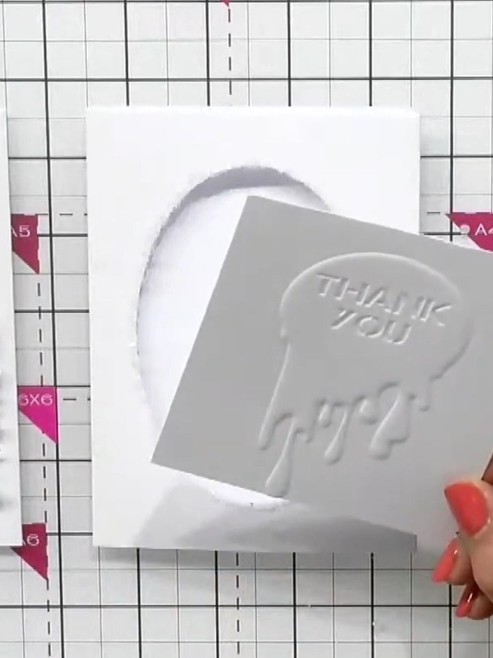 Step 7: Add a sentiment or embellishment to the card front. Position a 'Thank You' topper or other sentiment piece ont