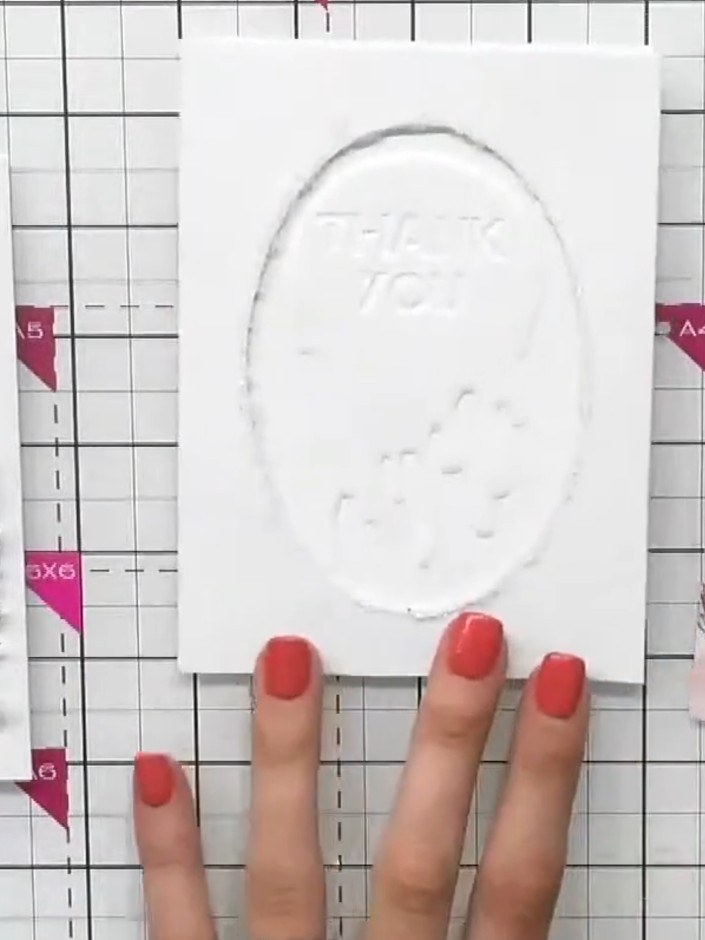 Step 8: Fold and seal the coordinating envelope to match your card. Position the floral toppers on the envelope flap t