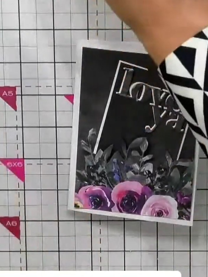 Step 8: Insert the finished card into the chosen envelope. The card front with the topper and floral design should fac