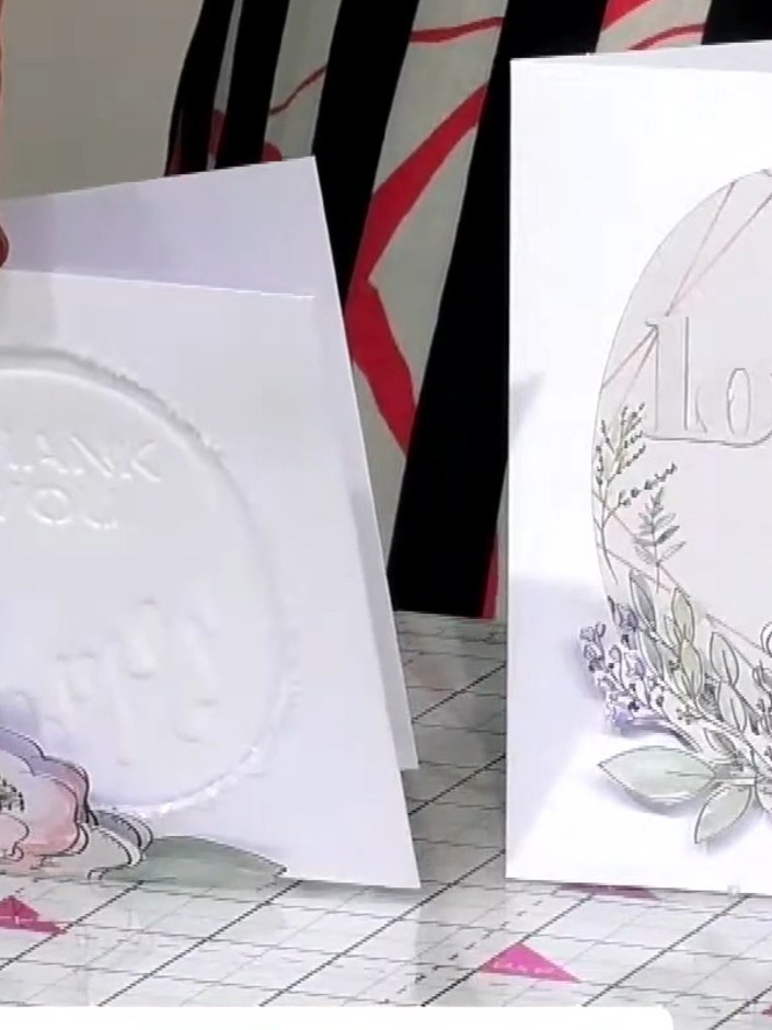 Step 6: Layer the padded decoupage elements on top of the base focal point using foam pads. Position the raised floral