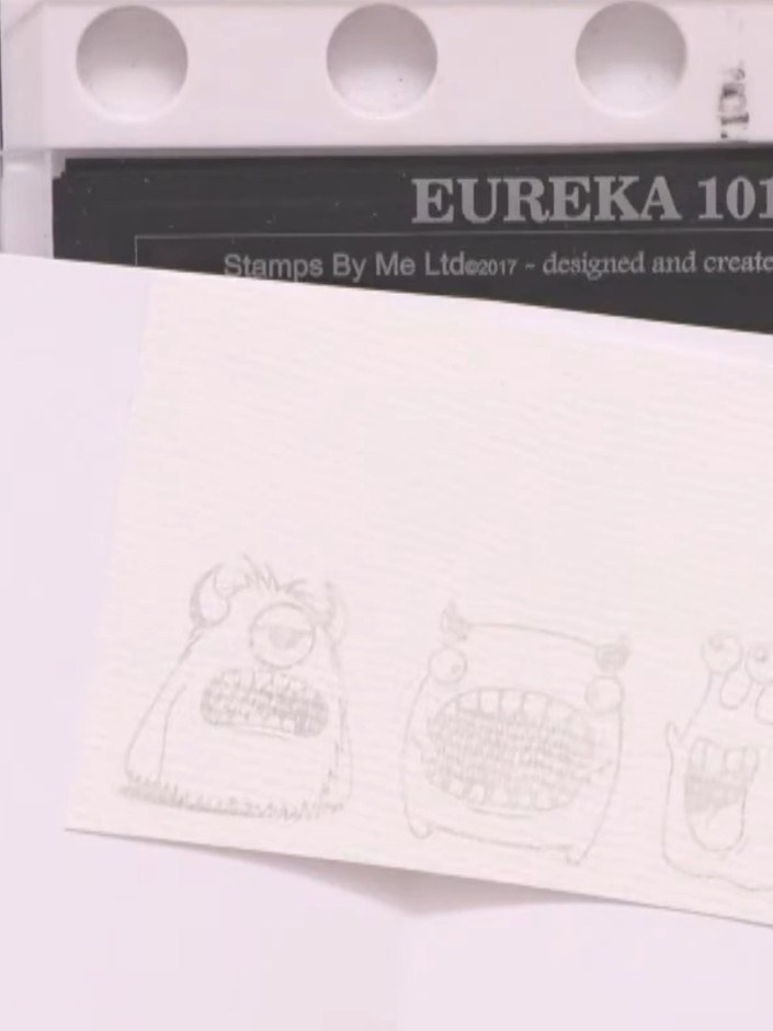 Step 4: Sprinkle white embossing powder generously over the stamped images, ensuring all the inked areas are completel