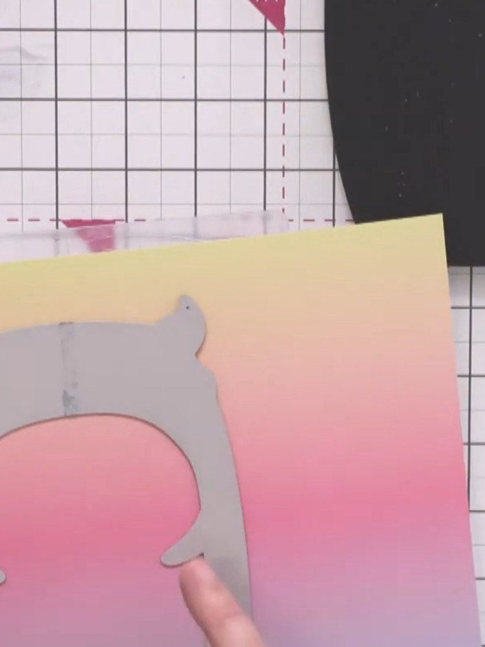 Step 3: Cut the monster's teeth from white card. Glue the teeth to the back of the coloured monster body piece, positi
