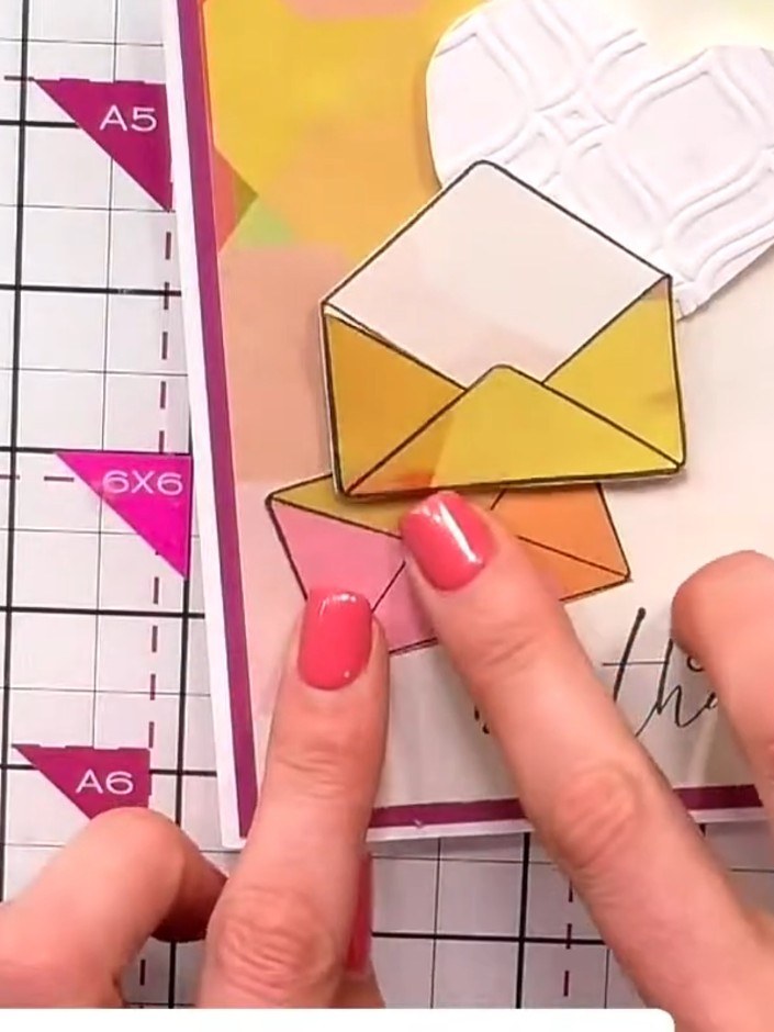 Step 6: Stamp floral elements onto the collection papers in various colours. Carefully fussy-cut around the stamped fl