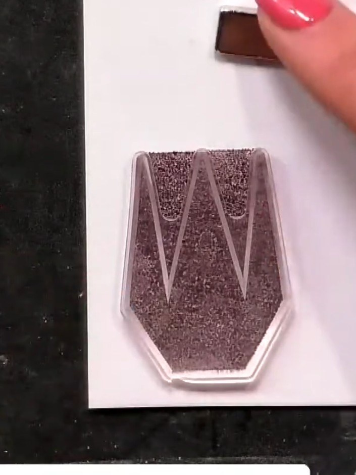 Step 3: Apply ink from the third embossing folder to your white card using the dauber. Build up the colour gradually t