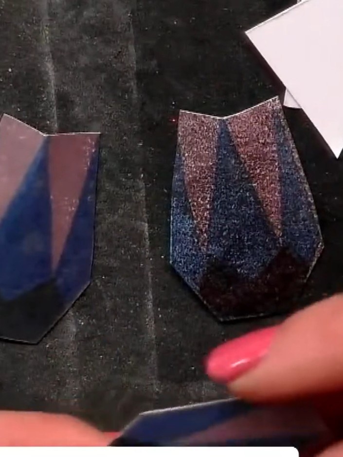 Step 7: Stamp and cut out foliage and leaf elements from the embossing folders. Pinch at the top of each piece to crea