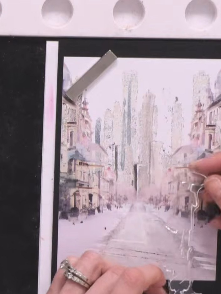 Step 2: Ink up the entire Dance in the Rain stamp with black ink. Stamp it half on and half off the paper to create a 