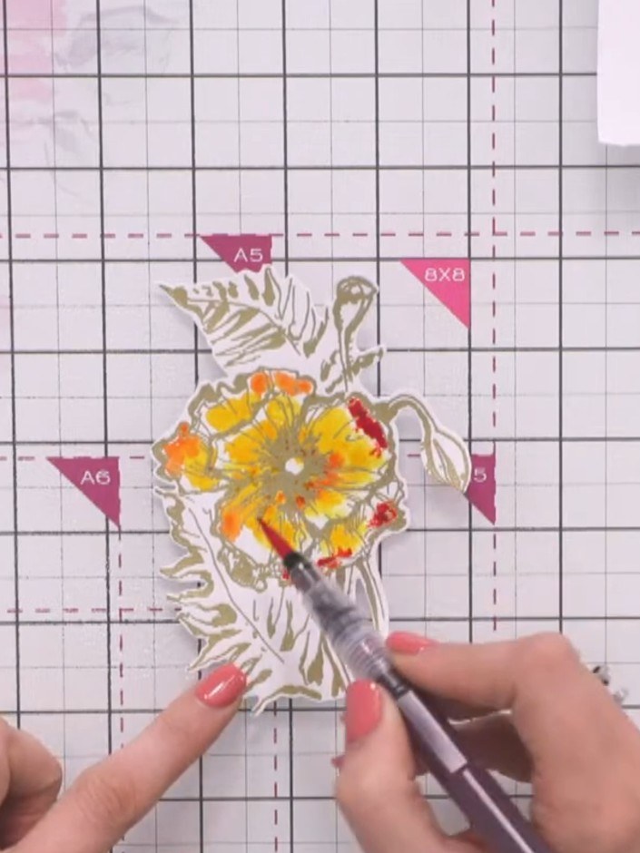 Step 11: Add red colour to additional areas of the flower petals using the watercolour marker pen, allowing it to blend