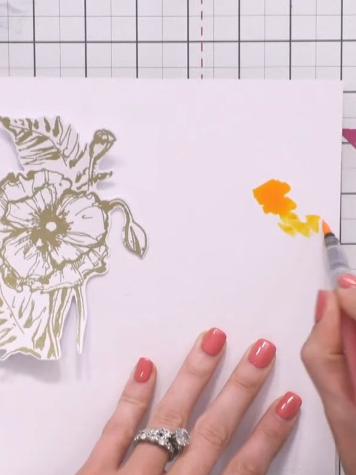 Step 9: Using an orange watercolour marker pen, drop colour onto the white cardstock in random places around the gold 