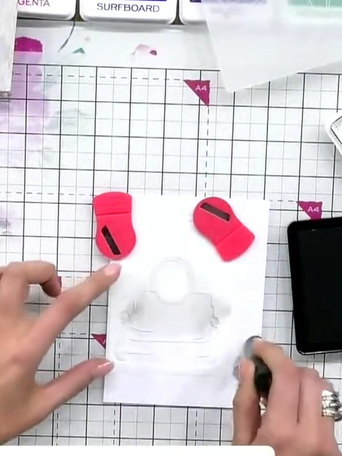 Step 2: Place the stencil over your white card base and use the black ink pad to apply ink through the stencil design.