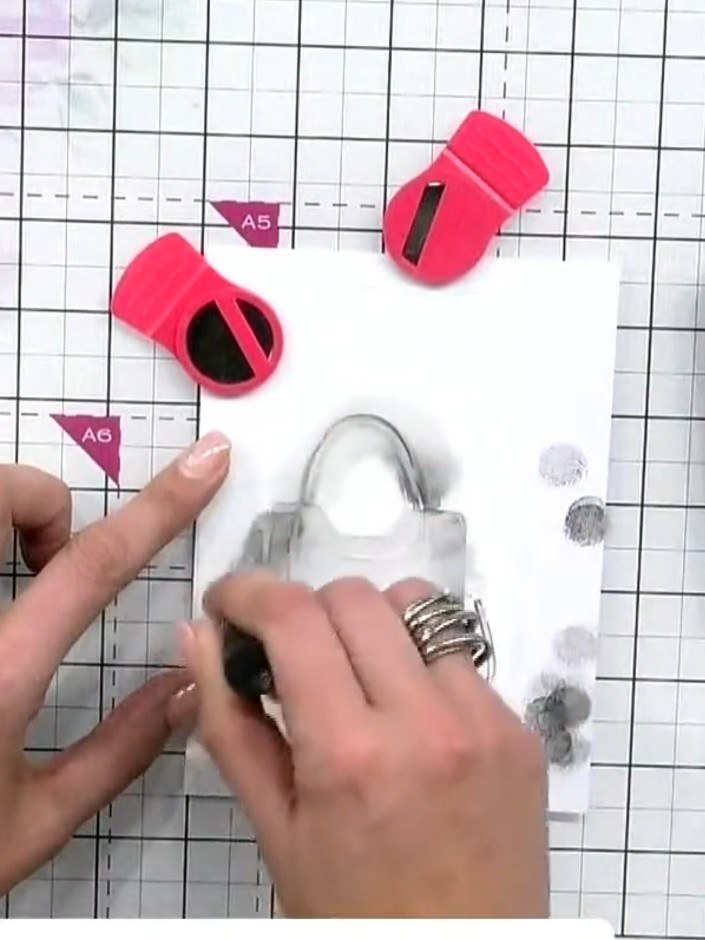 Step 3: Position stencil number two over your handbag design. Press black ink through the stencil using firm pressure 