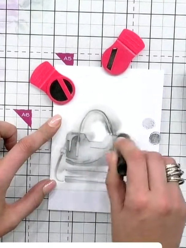 Step 4: Position stencil number three over your design and press black ink through firmly using a blending tool. This 