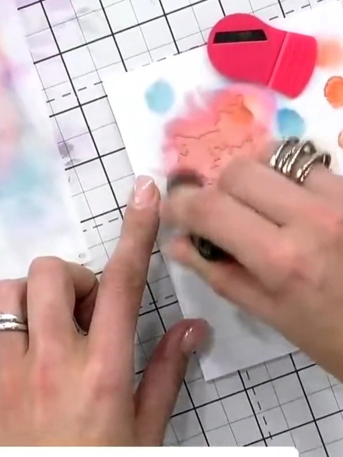 Step 3: Position stencil number two over your design and apply the same orange ink or a slightly darker shade. Press h