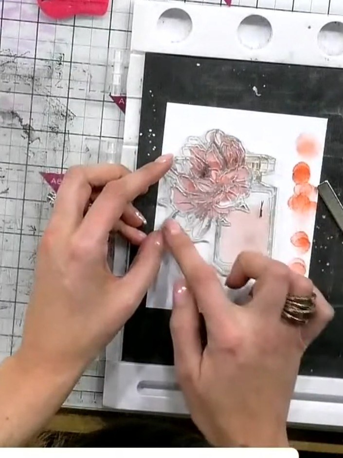 Step 5: Use the coordinating stamp with a sticky ink pad to add fine detail and hand-drawn elements to the perfume bot