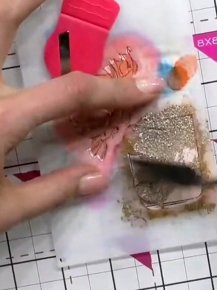 Step 8: For extra sparkle and dimension, apply gold sparkle paste to the centre of the perfume bottle using a palette 